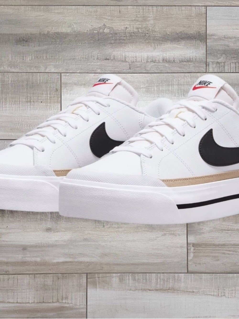 Nike White Low-Top Sneakers with Black Swoosh and Tan Accent